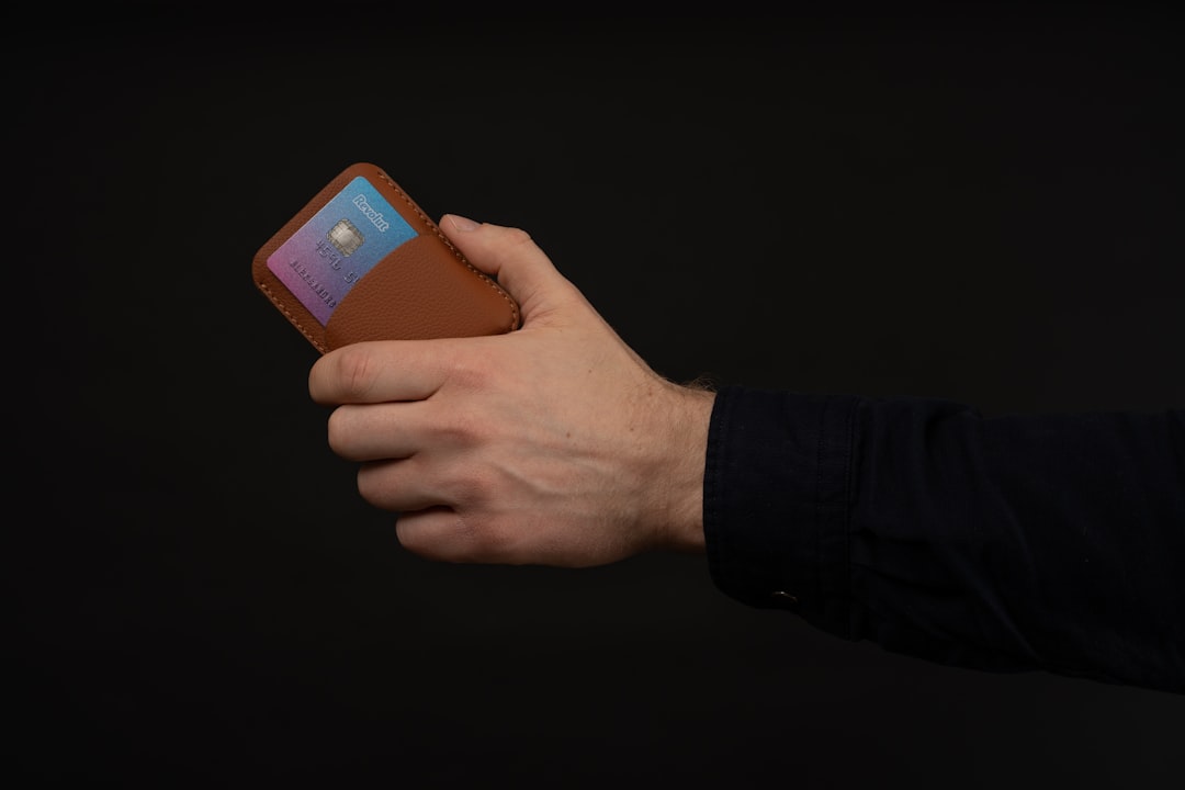 Close-up of a person using a smartphone app to unlock the smart lock on the front door of a modern home, demonstrating keyless entry and security.